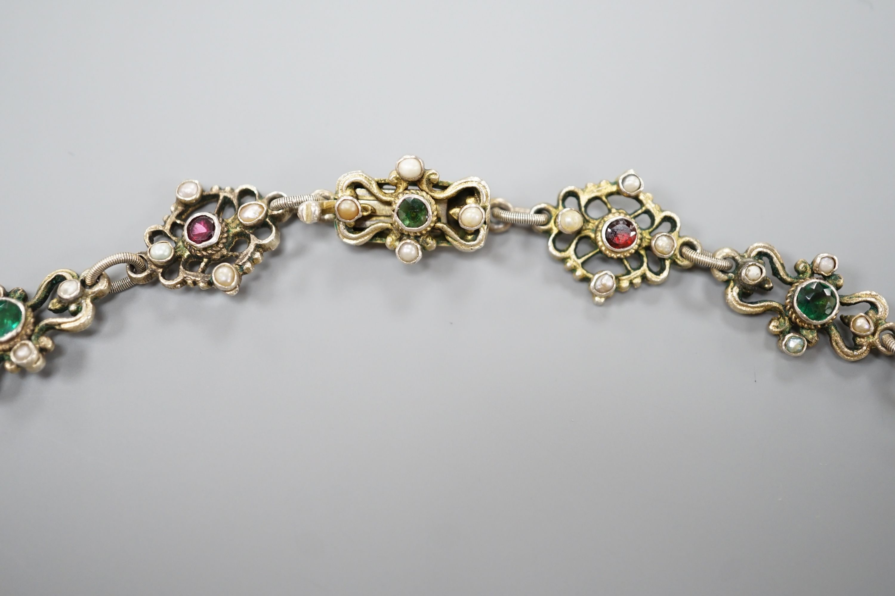 An ornate 19th century Austro-Hungarian gilt white metal, baroque pearl, paste and gem set drop necklace, 46cm, maker's mark WH or WM.